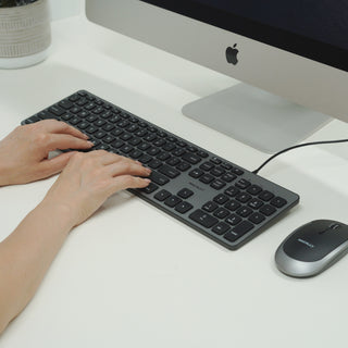 Macally wired keyboard and mouse combo for Mac in Space Gray - in use on a desk with an iMac