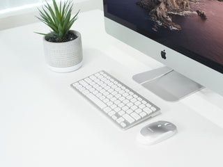 Macally USB keyboard for Mac in modern desk setup with iMac mouse and accessories
