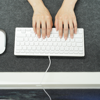 Macally compact keyboard and mouse combo in silver - typing on the slim wired keyboard